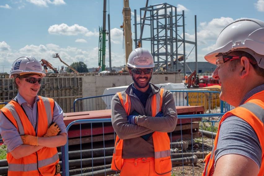 Left to right: NLHPP apprentices Hamish Bellinger (Waltham Forest resident) and Cameron Flanagan (Enfield resident) speaking with Councillor Clyde Loakes at Edmonton EcoPark