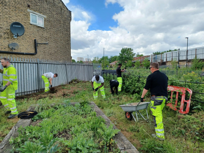 Volunteers helping in a community garden